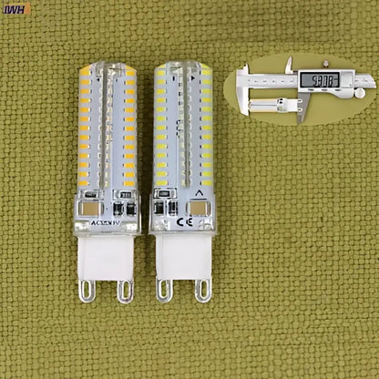 Two cylindrical white decorbites 3w led g9 bulbs with clear glass and metallic base ideal for kitchen lighting