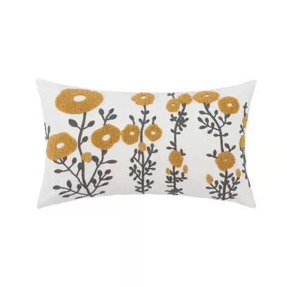 White rectangular pillow cover with embroidered mustard yellow flowers and dark gray stems for decorbites daisy home floral decor