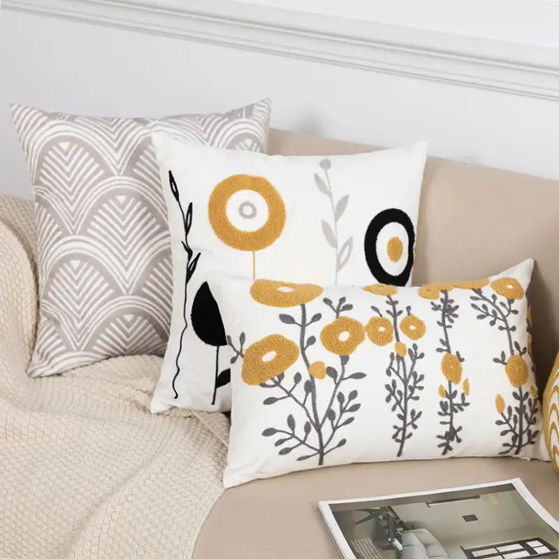 White rectangular cushion with daisy floral geometric embroidery in yellow and black for living room decorbites decor