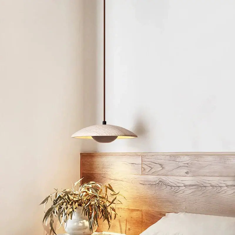 Minimalist danish cream stone wood chandelier with a sleek disc-shaped wooden shade and black stem for bedroom decorbites cream stone