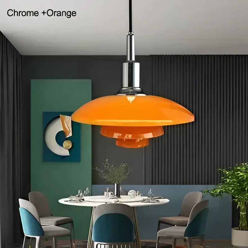 Danish tiered frosted glass pendant light with chrome finish and vibrant orange layered glass shade as a dining room focal point