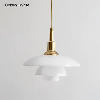 White layered glass pendant light with a golden brass fixture creating a focal point for dining room lighting