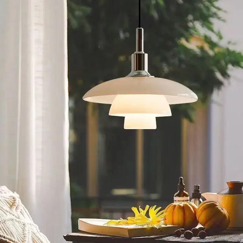Cream-colored Danish tiered glass pendant light with frosted tiers and sleek chrome finish for dining room focal point