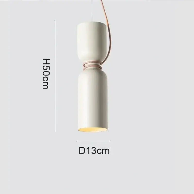 Cream-colored ceramic pendant light with copper-toned cord pendant and minimalist design for kitchen lighting