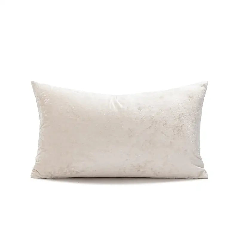 Cream-colored velvet rectangular pillow cover with plush texture and subtle sheen decorbites dark grain living room decor