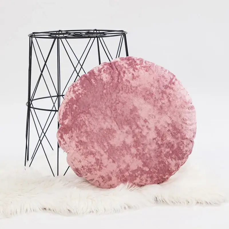 A plush round pink velvet pillow cover with a soft textured surface for decorbites dark grain living room decor