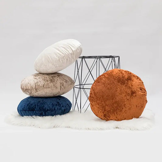Stack of round velvet pillow covers in white beige navy blue and rust orange for decorbites dark grain living room decor