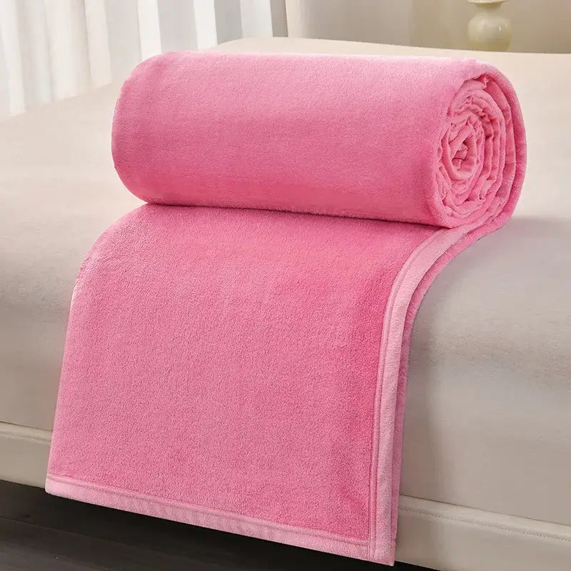 A soft vibrant pink plush blanket with textured surface and finished edges complementing decorbites cozy flannel sofa cover