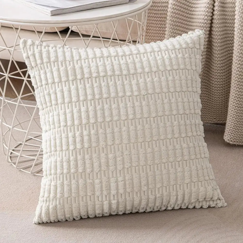 Cream-colored textured throw pillow with raised woven pattern complementing decorbites corduroy striped cushion cover