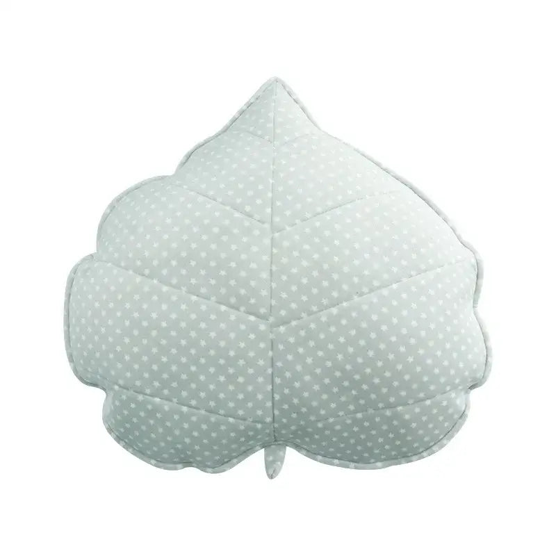 A soft plush light green leaf throw pillow with stitched edges and subtle white polka dots for bedroom decorbites 3d leaf
