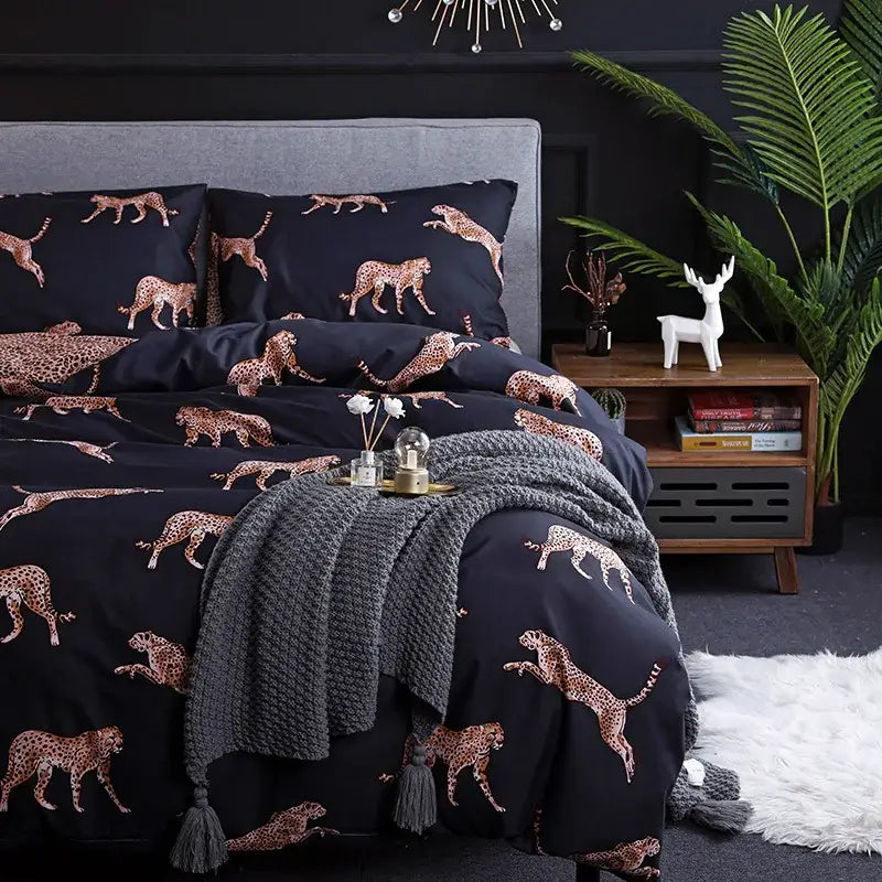 Dark green floral plush duvet cover set with a black duvet cover featuring gold-toned cheetah silhouettes cover set
