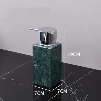 A sleek dark green marble soap dispenser with a polished chrome pump from the decorbites dark green bathroom set