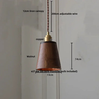 A warm-toned walnut wood glass led pendant lamp with copper fixture and adjustable braided wire for dining room
