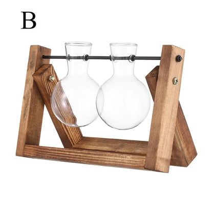 Clear glass bud vases with rounded globes and narrow necks on a rustic wooden stand for tabletop hydroponic plants