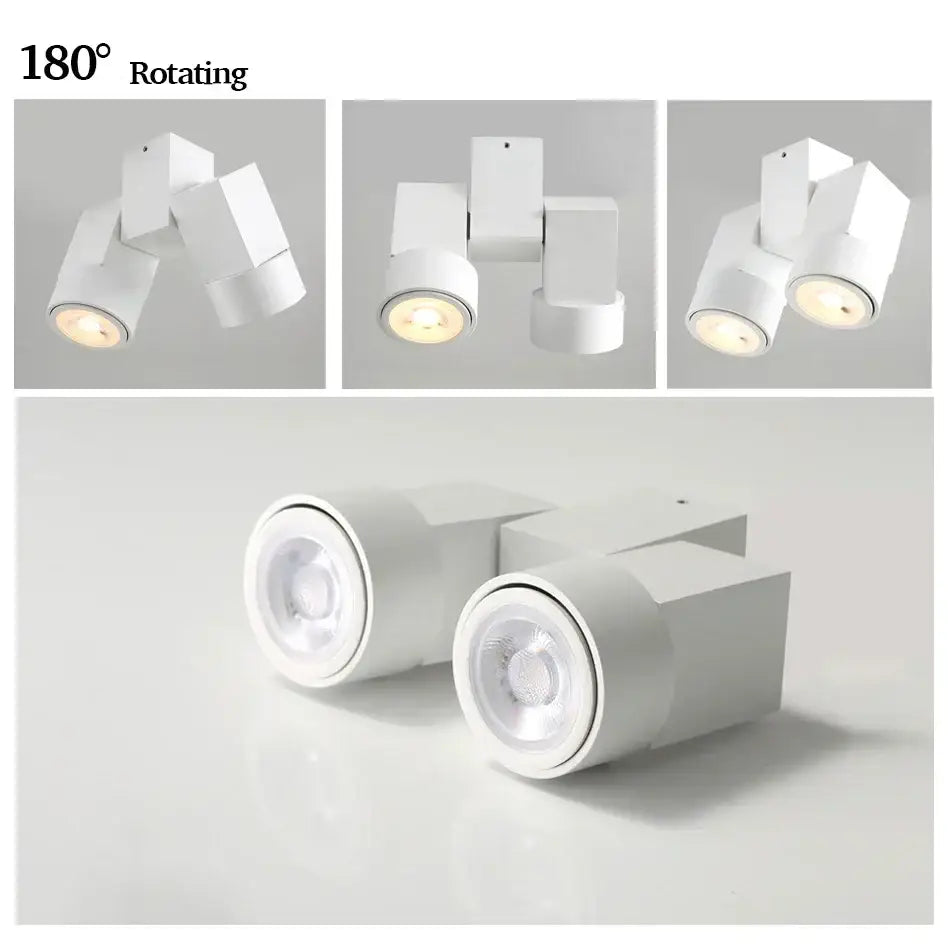 Modern white downlight surface mount with sleek geometric design and 180 degree rotating heads for living room use