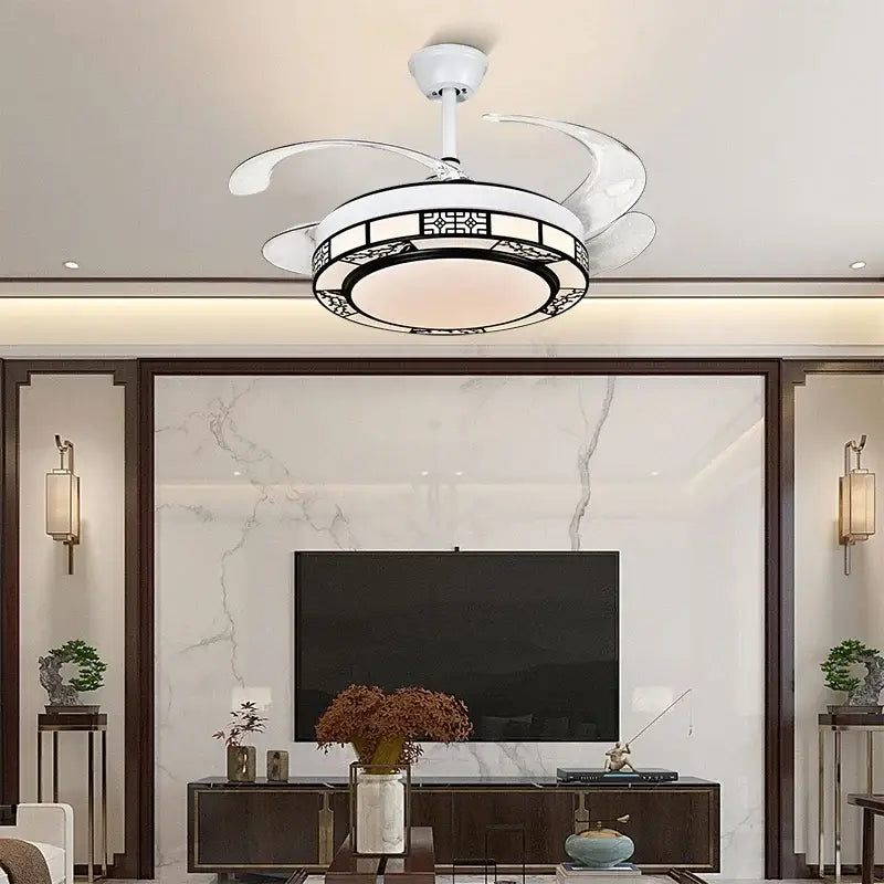 White ceiling fan with curved blades and ornate black-trimmed light fixture in modern geometric gold led ceiling fan design