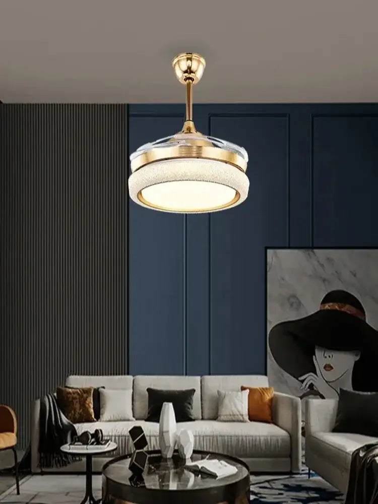 Gold-toned ceiling fan light with circular frosted glass shade and integrated led lighting for bedroom use