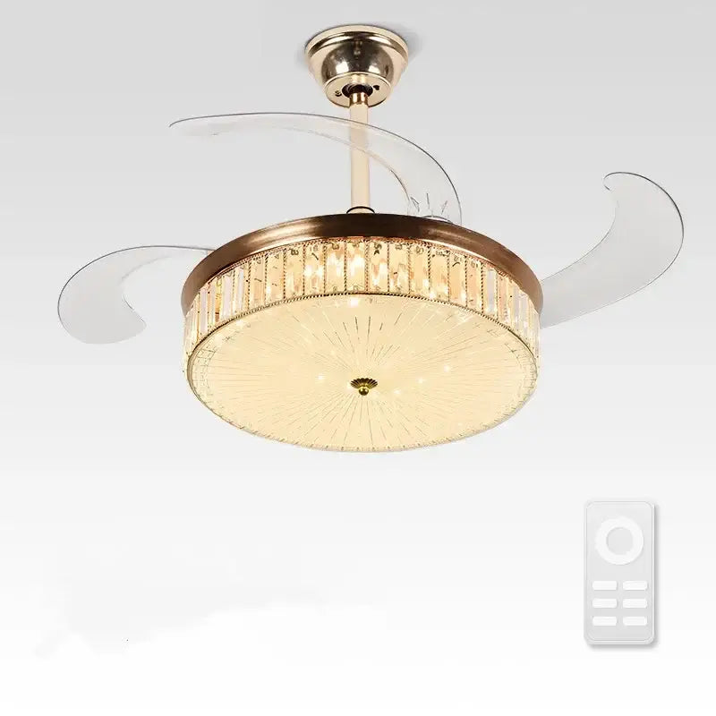 A modern gold ceiling fan with retractable transparent blades and brass crystal accents for bedroom lighting with remote control