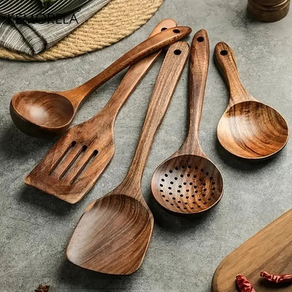 Set of five handcrafted teak wooden cooking spoons in warm brown tones with natural wood grain patterns
