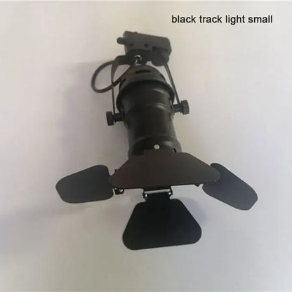 Black decorbites™ cob led track light with adjustable metal arms and four leaf-shaped shades for clothing store spotlight