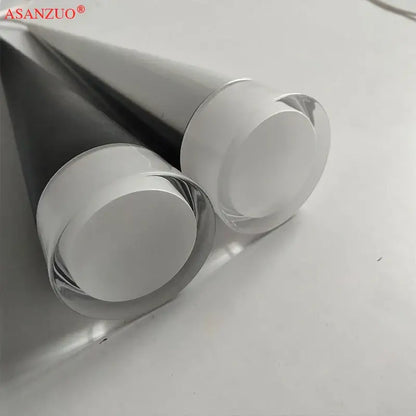 Two sleek glass tubes with polished metallic ends in a silver black aluminum led pendant light for kitchen island