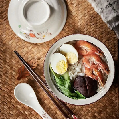 White ceramic ramen bowl with brown rim filled with seafood noodles from DecorBites retro ceramic ramen bowl set