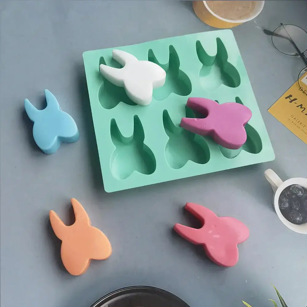 Mint green silicone mold and matching white blue pink and orange hole tooth silicone molds for 3d baking use