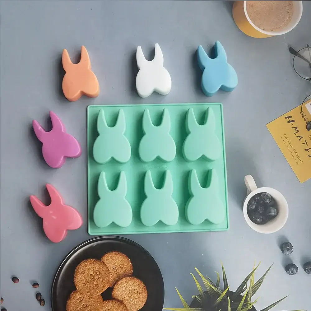Decorbites™ mint green silicone mold with six bunny-shaped cavities for cake biscuit candy and ice cube use