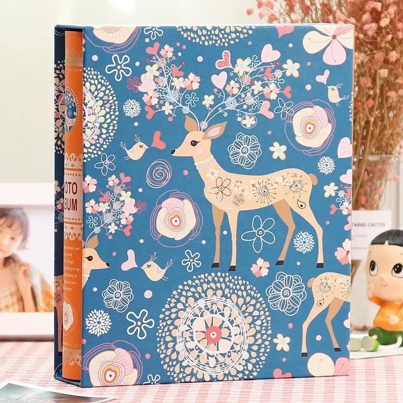 Blue scrapbook album with whimsical deer and pastel floral design orange spine decorbites family baby wedding use