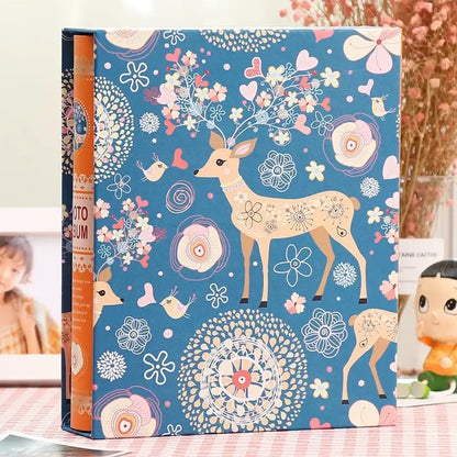 Blue scrapbook album with whimsical deer and pastel floral design orange spine decorbites family baby wedding use