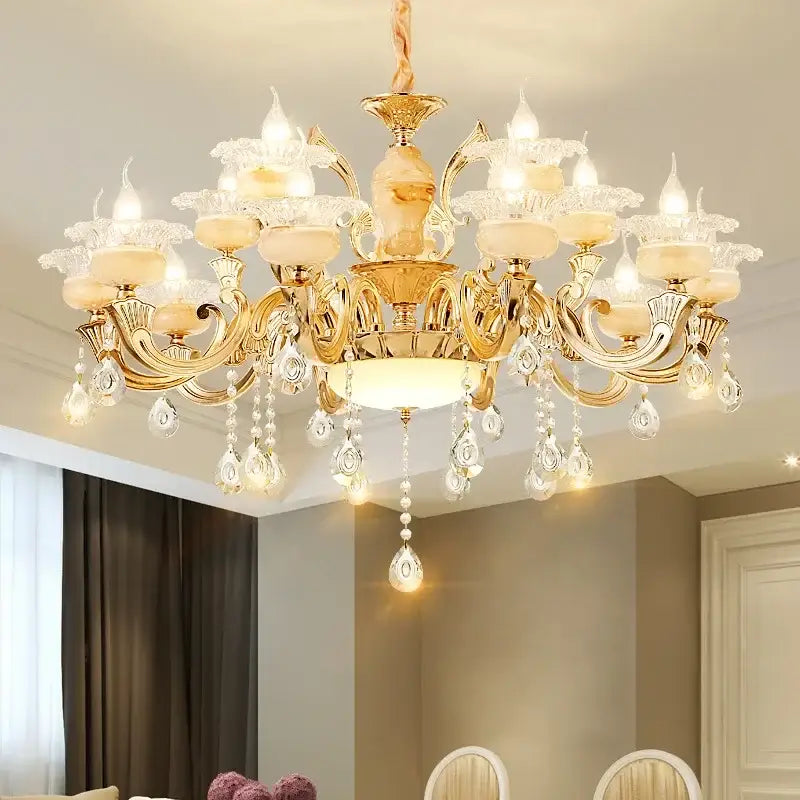 Gold-toned led dolomite chandelier with ornate arms frosted glass shades and crystal teardrops for foyer and living room