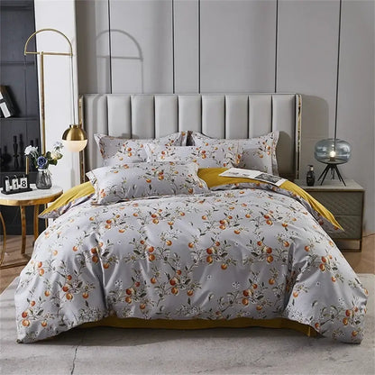 Gray duvet cover with delicate orange fruit floral pattern and gold trim in decorbites 600tc egyptian cotton bedding set