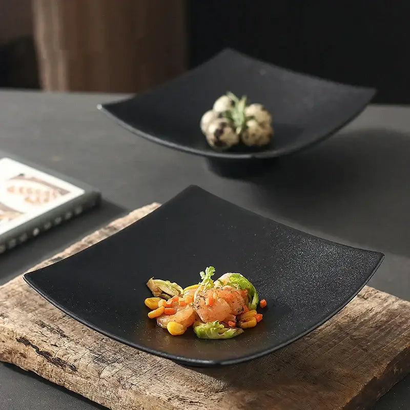 Black matte ceramic dining plate decorbites 7.5 inch square with slightly curved edges and a matte finish