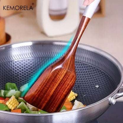 A sleek polished wooden cooking utensil with a white handle from the DecorBites thai wooden cooking utensil set