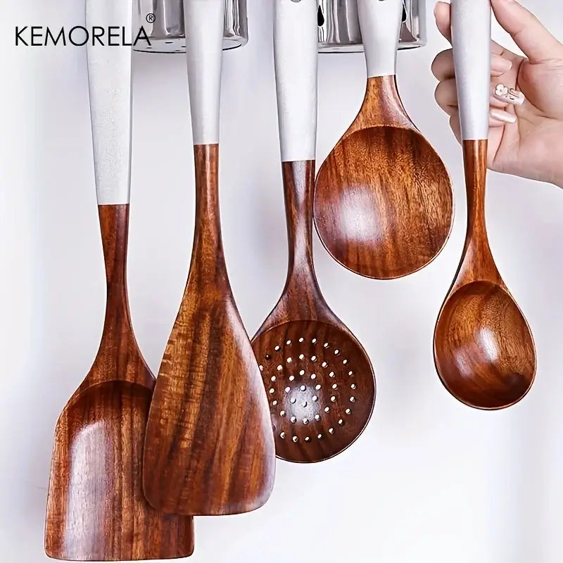 Set of five eco-friendly thai wooden cooking utensils with white handles featuring spatula and spoons in cooking utensil set
