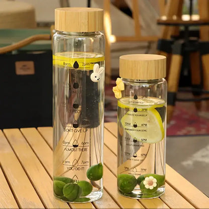Decorbites 700ml glass water bottle with bamboo lid yellow time marker and motivational phrases with stainless steel filter