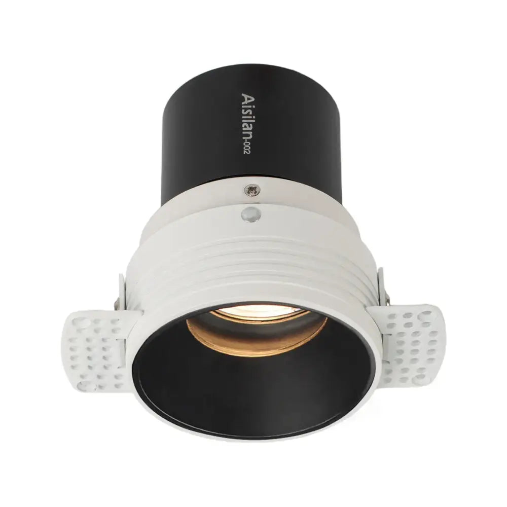 Black and white decorbites 7w cri97 led downlight with textured side flanges and modern recessed ceiling design