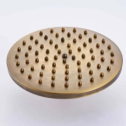 Round brass rainfall shower faucet head with multiple nozzles in antique brass finish for refreshing showers