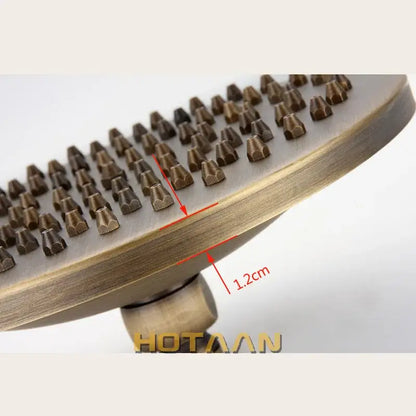 Decorbites 8 inch copper round overhead rain shower head in antique brass finish with textured cone nozzles