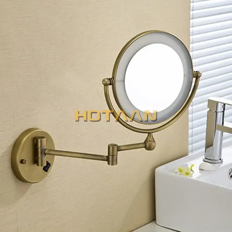 Brass-finished round led light makeup mirror with dual 3x/1x magnification and adjustable arm by DecorBites