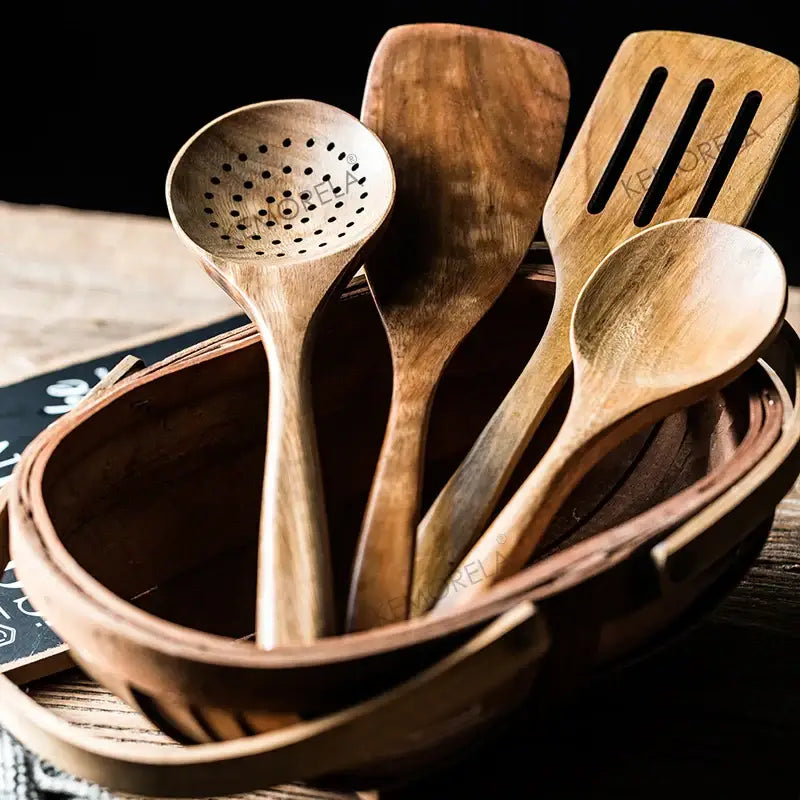Set of four natural wood cooking utensils in a woven basket from decorbites teak wooden cooking utensils set