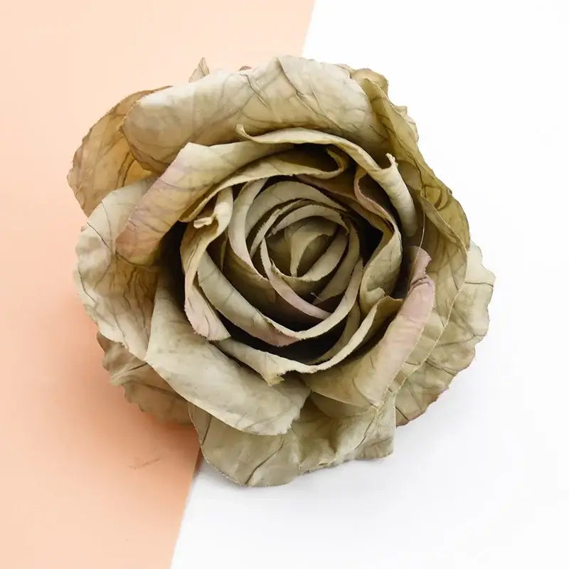 A dried beige decorbites™ 9cm silk rose artificial flower with delicate crinkled petals in a natural spiral arrangement