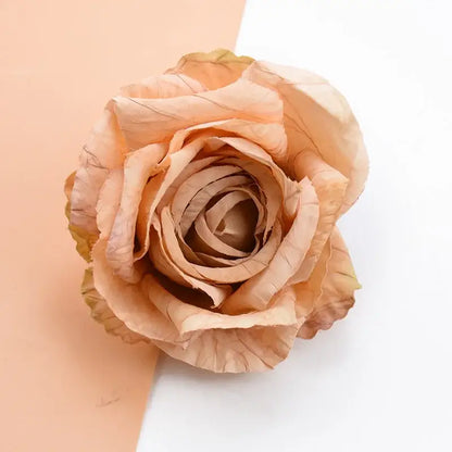 A delicate peach-colored 9cm silk rose with layered petals and subtle brown edges from DecorBites™ artificial flowers