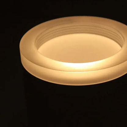 A sleek frosted glass candle holder with warm glow illustrating decorbites 9w cri97 anti-glare led downlight features