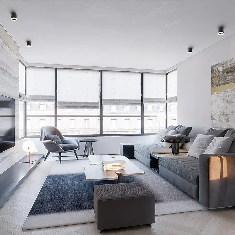 Gray sectional sofa with plush cushions displayed under decorbites 9w cri97 anti-glare led downlight for living room