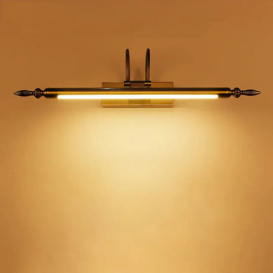 Brass-finished decorbites 9w led wall-mounted vanity light with spear-tipped ends and warm glowing illumination