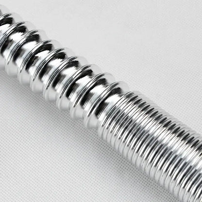 A shiny metallic silver coiled spring with ribbed texture in decorbites abs kitchen sewer pipe for sink and basin drainage