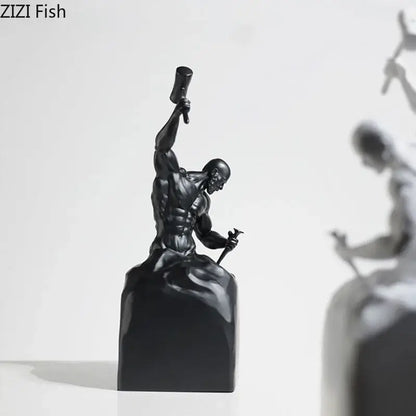 Black resin DecorBites™ character statue of a muscular artisan with hammer and chisel for sculpting oneself abstract artworks