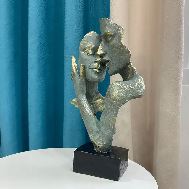 Decorbites abstract art couple mask statue figurines with metallic green and gold intertwined faces on black base