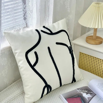 White cushion cover with black embroidered abstract human silhouette in decorbites abstract art line design